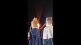 Dan Reynolds letting cancer kids sing with him