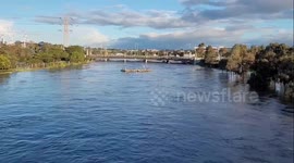 Australia: Pontoon Floats Down Swollen River As Floods Hit Victoria