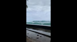 Monster waves wash away dance floor, bar, and tables at wedding reception in Hawaii