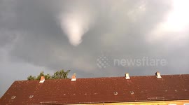 Tornado caught brewing right behind a house