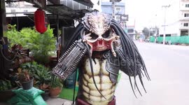Kebab chef wears 'Predator' alien costume while serving customers in Thailand