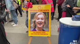 Portrait of UK PM Liz Truss in a Shell frame during demonstration in London