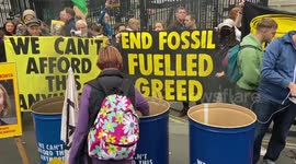 Extinction Rebellion protesters burn energy bills outside Downing Street