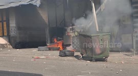 Palestinian protesters clash with Israeli troops in Hebron in the West Bank amid surge in tension