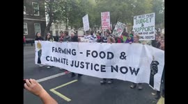 Farming, food, and climate justice protesters march through London chanting for change