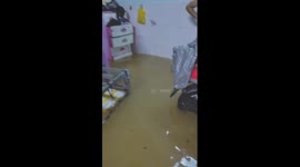 People try to save belongings as floodwaters inundate Da Nang, Vietnam