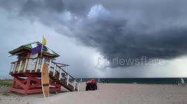 Dark skies as waterspout forms off Delray Beach in Florida