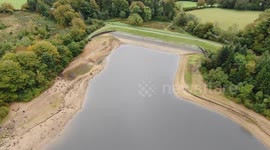 Shocking drone video shows the 'dangerously' low levels at a major reservoir amid warnings further restrictions on water use could be brought in