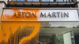 Just Stop Oil activists arrested after spraying orange paint over Aston Martin dealership on Park Lane, London