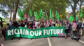 'Reclaim Our Future': Extinction Rebellion supporters march through London's Hyde Park