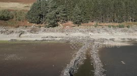 Lost English hamlet emerges from Haweswater Reservoir in the Lake District during drought conditions despite heavy rain