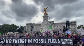 'Rebel to repair': Extinction Rebellion march past Buckingham Palace on way to UK parliament