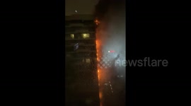 Fire engulfing high-rise building in Istanbul seen from adjacent apartment