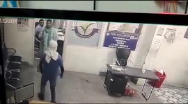 Brave Women bank manager prevents loot fighting robber with sharp edged weapon