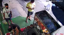 Time-lapse footage shows flood emerging from manhole cover in Thai market