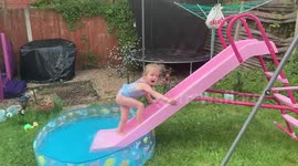 Slipping and sliding into the paddling pool in the garden