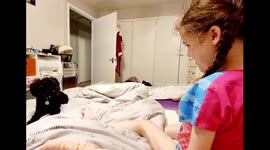 Cute Toy Poodle helps disabled girl take her socks off part 2 in bed