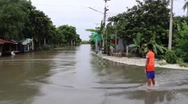 Water submerges road as floods continue across Thailand