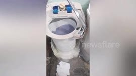 Cheapskate housewife fixes shabby washing machine with duct tape to dry clothes