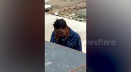 Man facepalms as female dancers twerk onstage