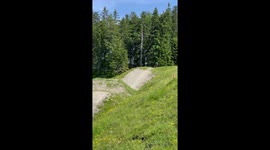 backflip attempt with MTB on a huge jump goes horribly wrong