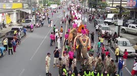 Traffic enforcer on duty delights locals when he joins performers for traditional Thai dance
