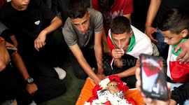 Hundreds attend funeral of Palestinian teenager shot dead during clashes with Israeli forces