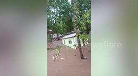 Homes swept away as thunderstorm floods village in the Philippines