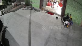Boys lift scooter up to free younger brother trapped underneath
