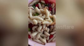 Popular Burmese snack made with live bamboo worms as the main ingredient