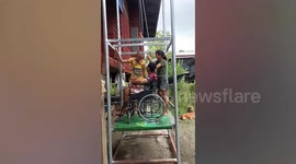 Paraplegic villager uses DIY elevator to enter his house