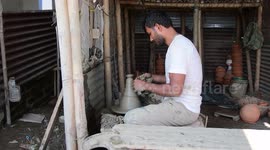 Potter makes earthen lamps ahead of the Hindu Diwali festival in India