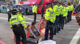 Just Stop Oil activists sit in middle of London's Upper Street causing heavy traffic
