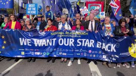 Thousands of protesters take part in the National Rejoin March that passes through the streets of central London.