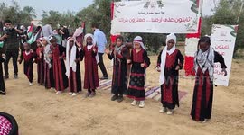 Palestinians attend ceremony marking the start of the olive harvest season
