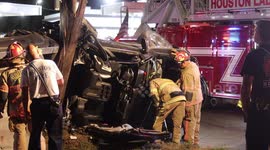 Woman rescued after being trapped in a truck that wrapped around a utility pole in Houston, Texas