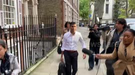Rishi Sunak leaves his campaign office after announcing his leadership bid