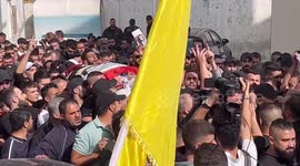 Palestinian mourners carry the body of Tamer al-Kilani during his funeral in the West Bank city of Nablus