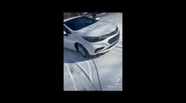 Car slides off road into mailboxes after first snow