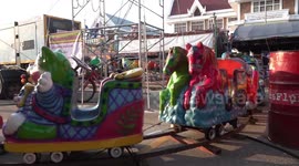 Locals enjoy Buddhist festival carnival at temple in Thailand