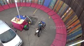 Fearless motorbike rider and car driver perform stunts on 'wall of death'