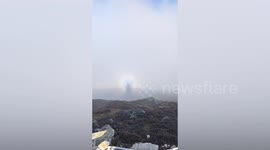 Rare 'Buddha's halo' surrounds tourist's shadow in China
