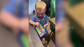 Adorable video shows toddler clutching picture of his mum after she left the house for just over one hour