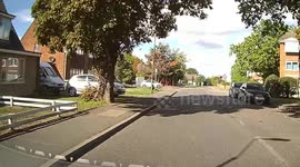 A woman pulls out without looking forcing the car on the main road to use the horn and do an emergency stop