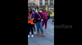 Woman gives a speech at manufestation for domestic violence awareness in New York, USA