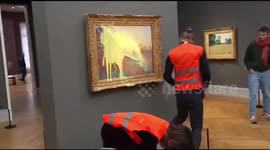 Moment climate activist threw mash potato over Monet painting in Germany
