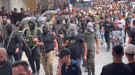 Mourners attend the funeral of Palestinians killed in an overnight Israeli raid, in the West Bank city of Nablus