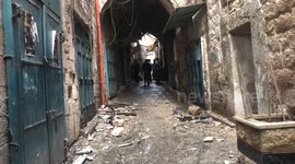 Palestinians inspect the damaged after an Israeli military raid