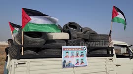 Palestinian protesters burn tires during a protest near the fence with Israel east of Gaza city against the killing of Palestinians on overnight Israeli raid in Nablus
