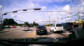 Motorist in Miami runs red light in front of cop